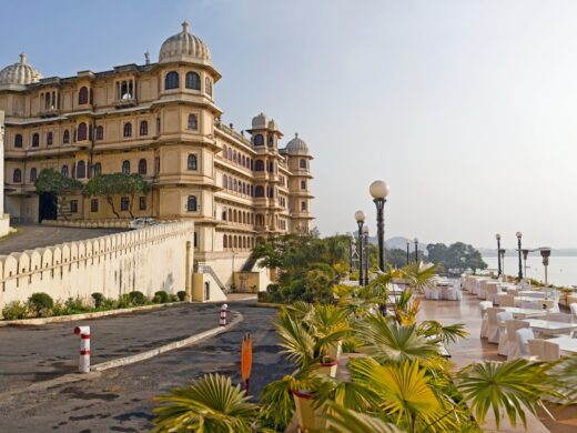 The City Palace historic palace building on the shores of the lake at Udaipur India.