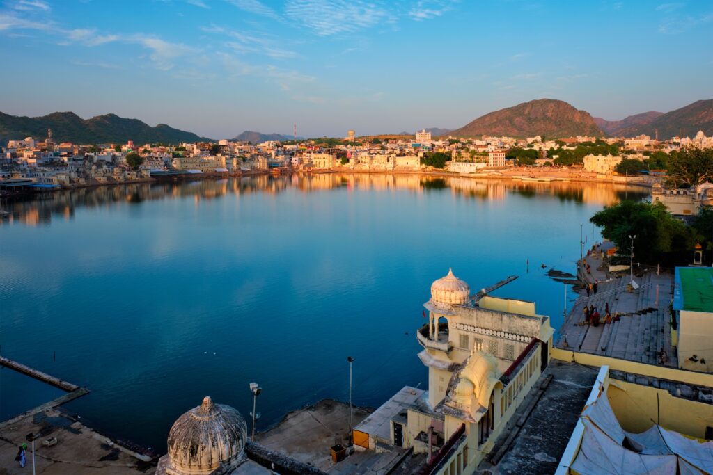 Brahma mandir temple, lake and traditional Pushkar ghats at dusk sunset. Rajasthan, India