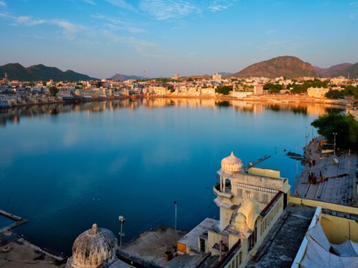 Brahma mandir temple, lake and traditional Pushkar ghats at dusk sunset. Rajasthan, India