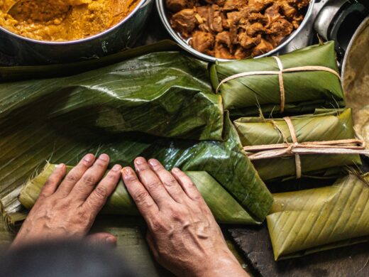 Overhead   shot of person preparing honduran tamales