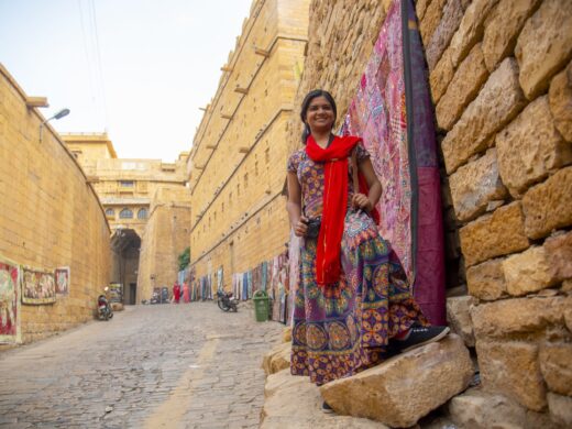 Woman tourist at golden fort Jaisalmer, India.