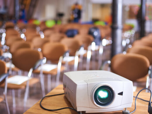 Working projector at the empty conference hall